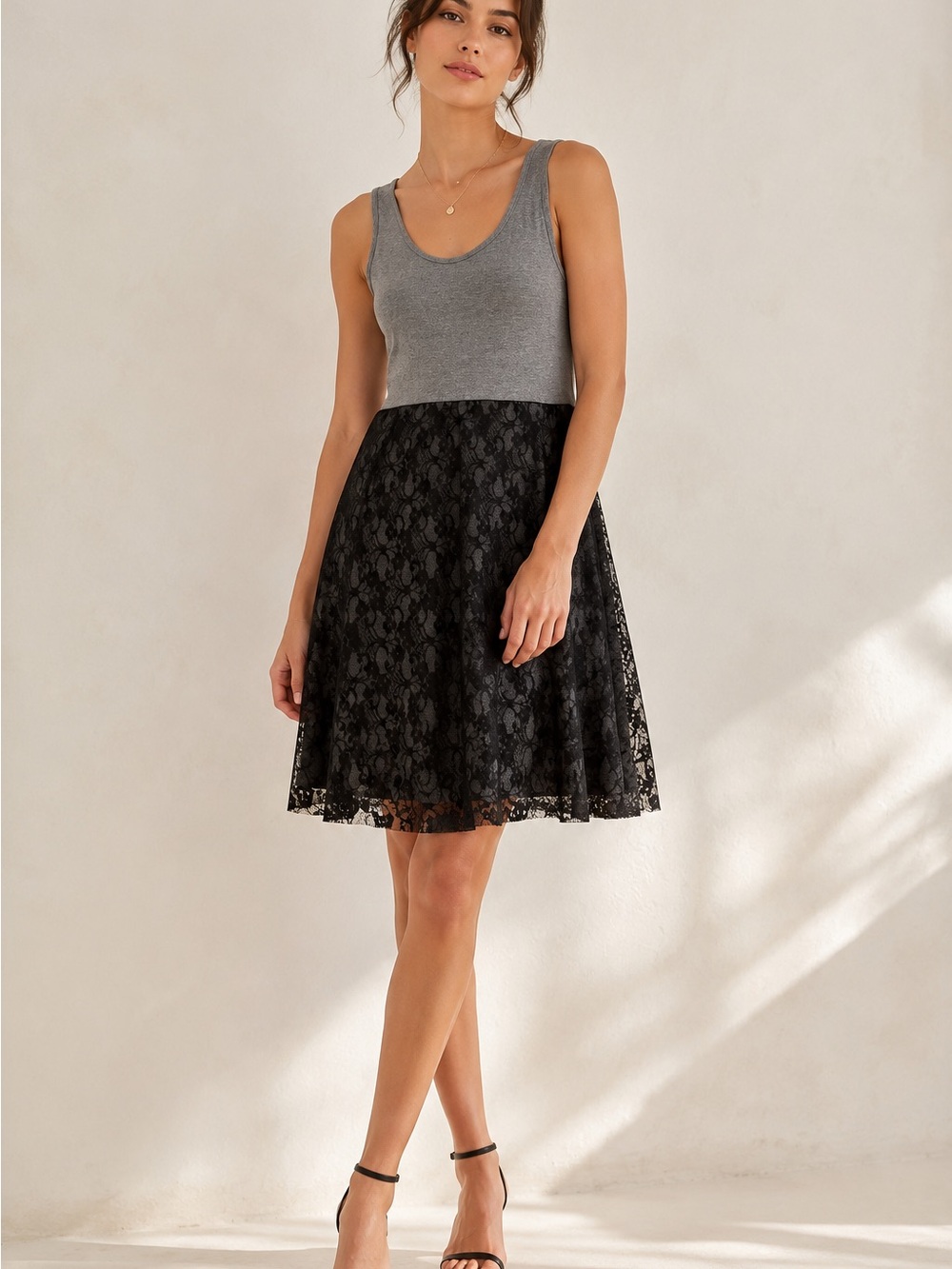 Light and flowy dress with black lace skirt on grey base